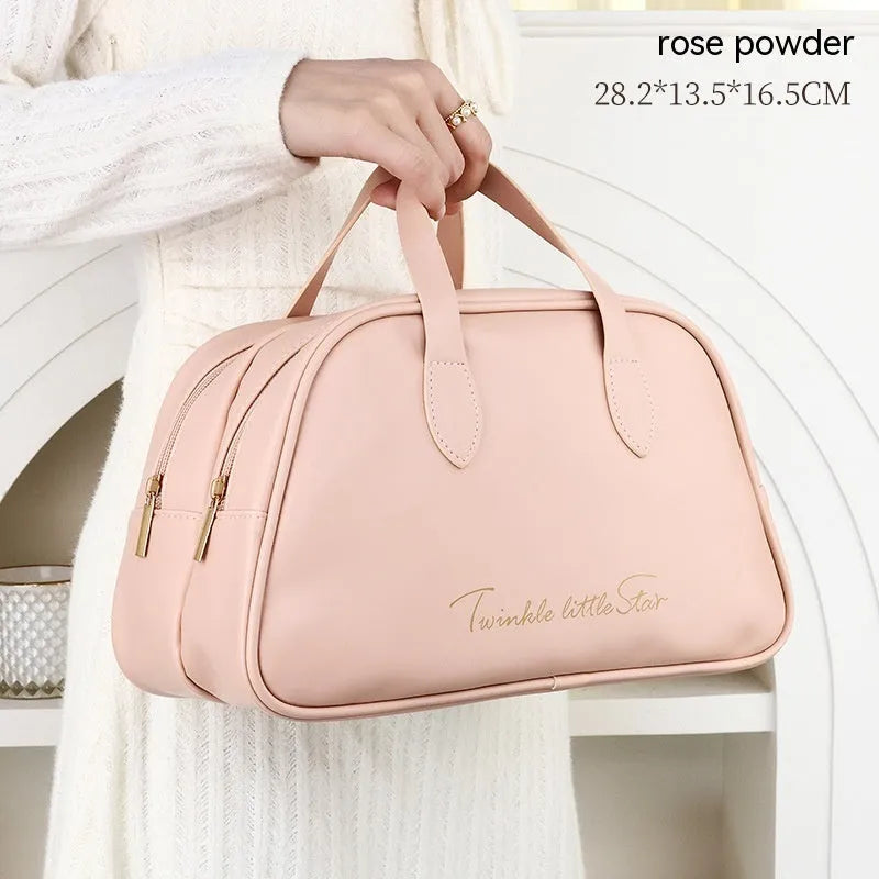 PU leather travel toiletry bag in classic black colour, showing large capacity and zipped compartments.