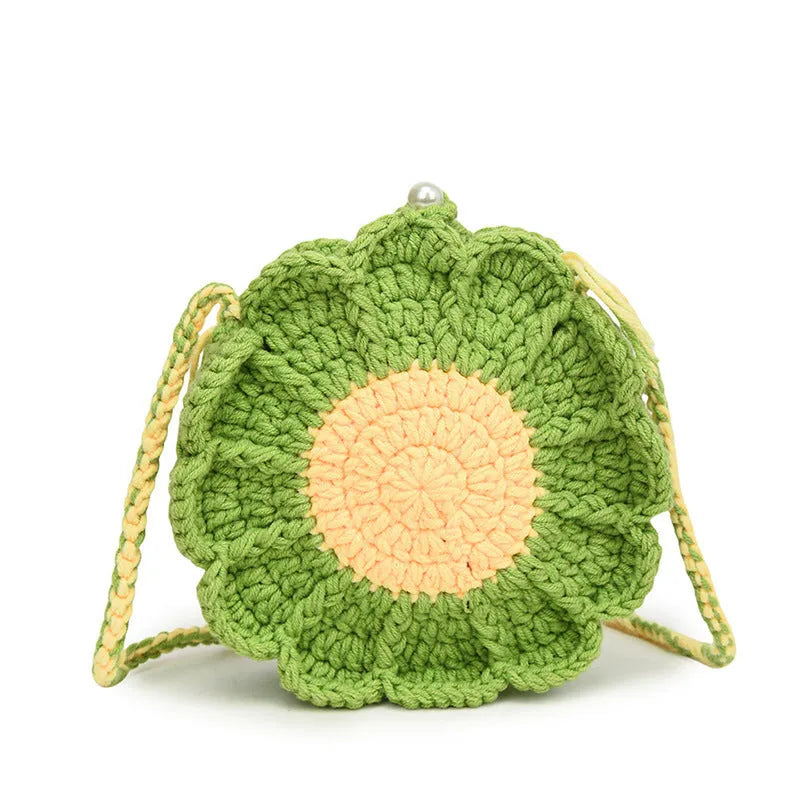 Hand-woven bag with crocheted wool flowers and mobile phone compartment in round suitcase shape