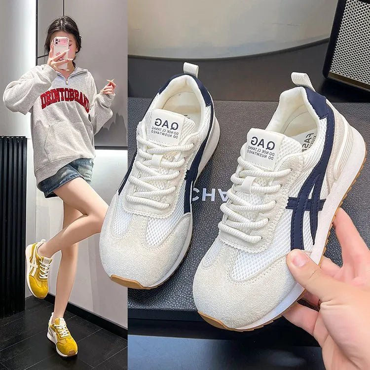 Women's white casual lace-up sneakers with round toe and non-slip sole on a plain background.