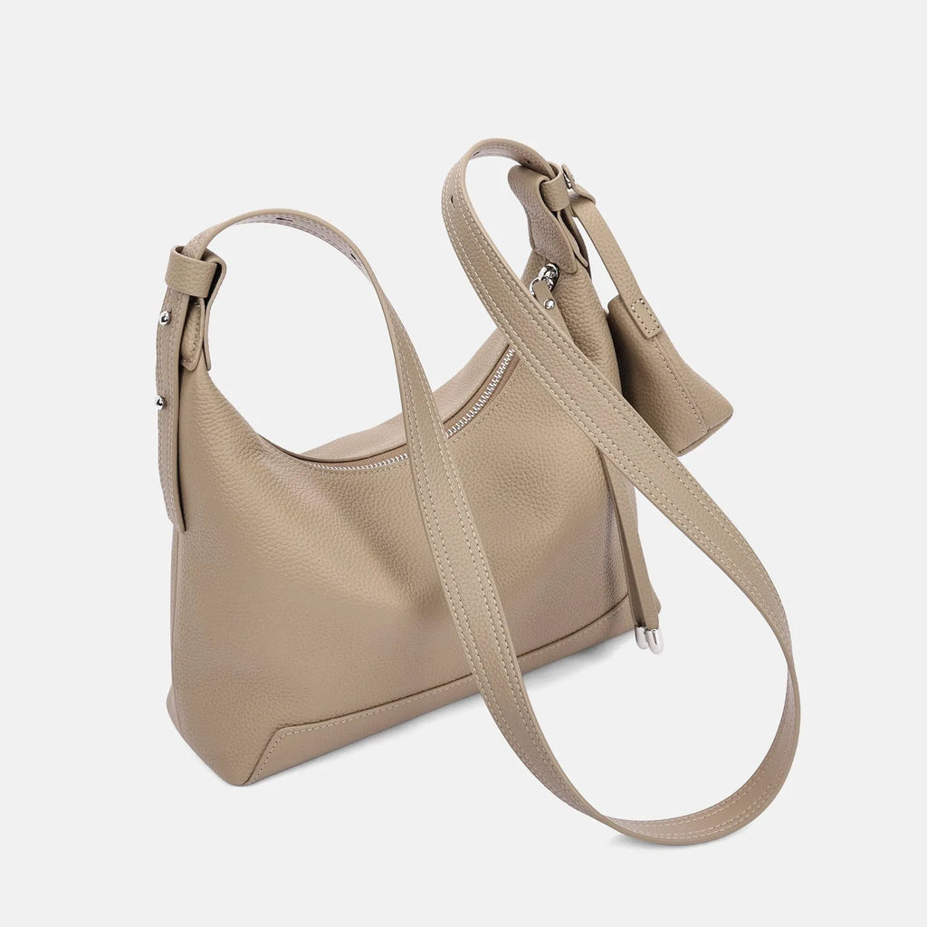 Genuine cowhide leather shoulder bag in urban simplicity style with visible sewing thread details