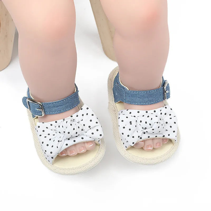 White and black low-tube Velcro baby shoes showing sizes 11cm, 12cm, and 13cm