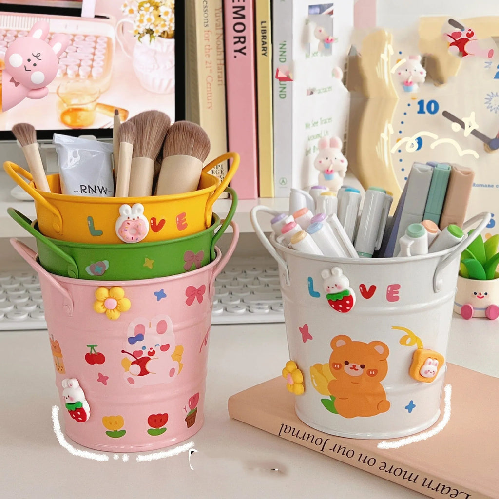 Round metal desk pen holder with iron art design in colour options including pink, green, red, white, and yellow