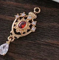Small crown hollow water drop pendant with micro inlaid zircon details in five colours.