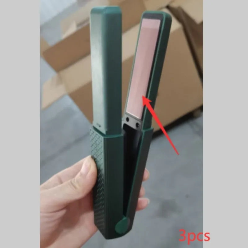 Pink and green mini cordless USB hair straightener with ceramic plates open on a white background.