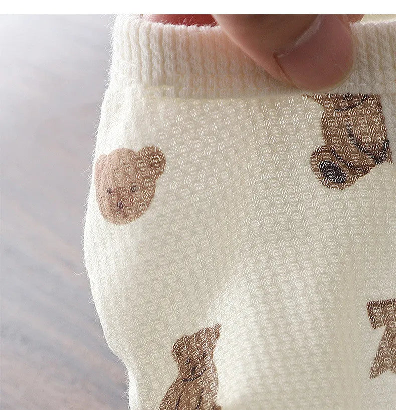 Beige waffle short-sleeve small dog top on a dog, side view, polyester fabric