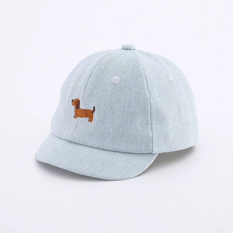 Denim puppy baseball cap for babies with 48cm head circumference in light blue
