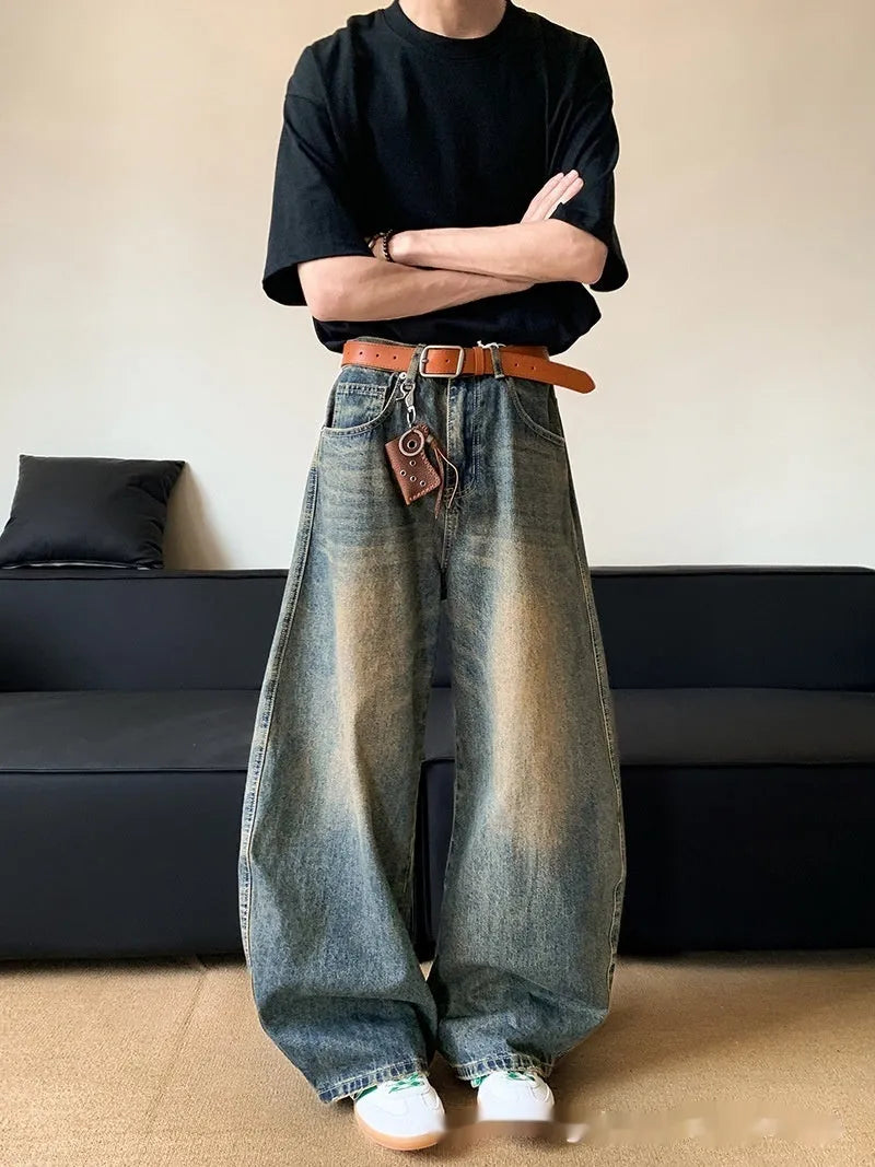 Men's retro blue distressed denim jeans with machete detailing and wide-leg fit