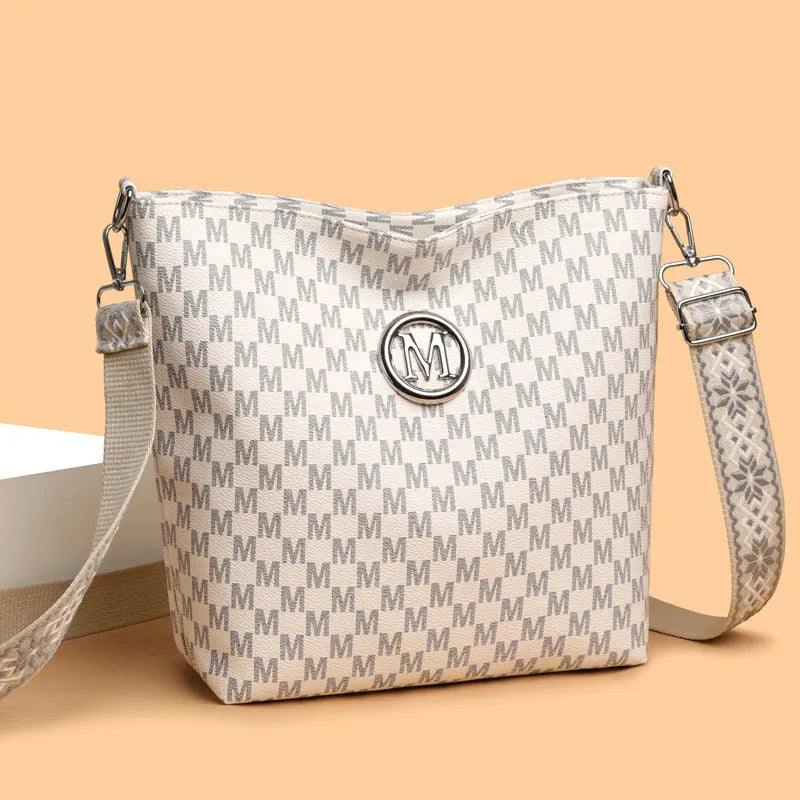 PU dumpling shape shoulder bag in black showing structured design with sandwich pocket