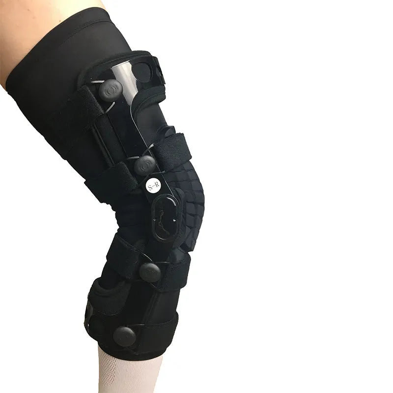 Black anterior ligament knee pad with iron stabilisers showing multi-layer construction