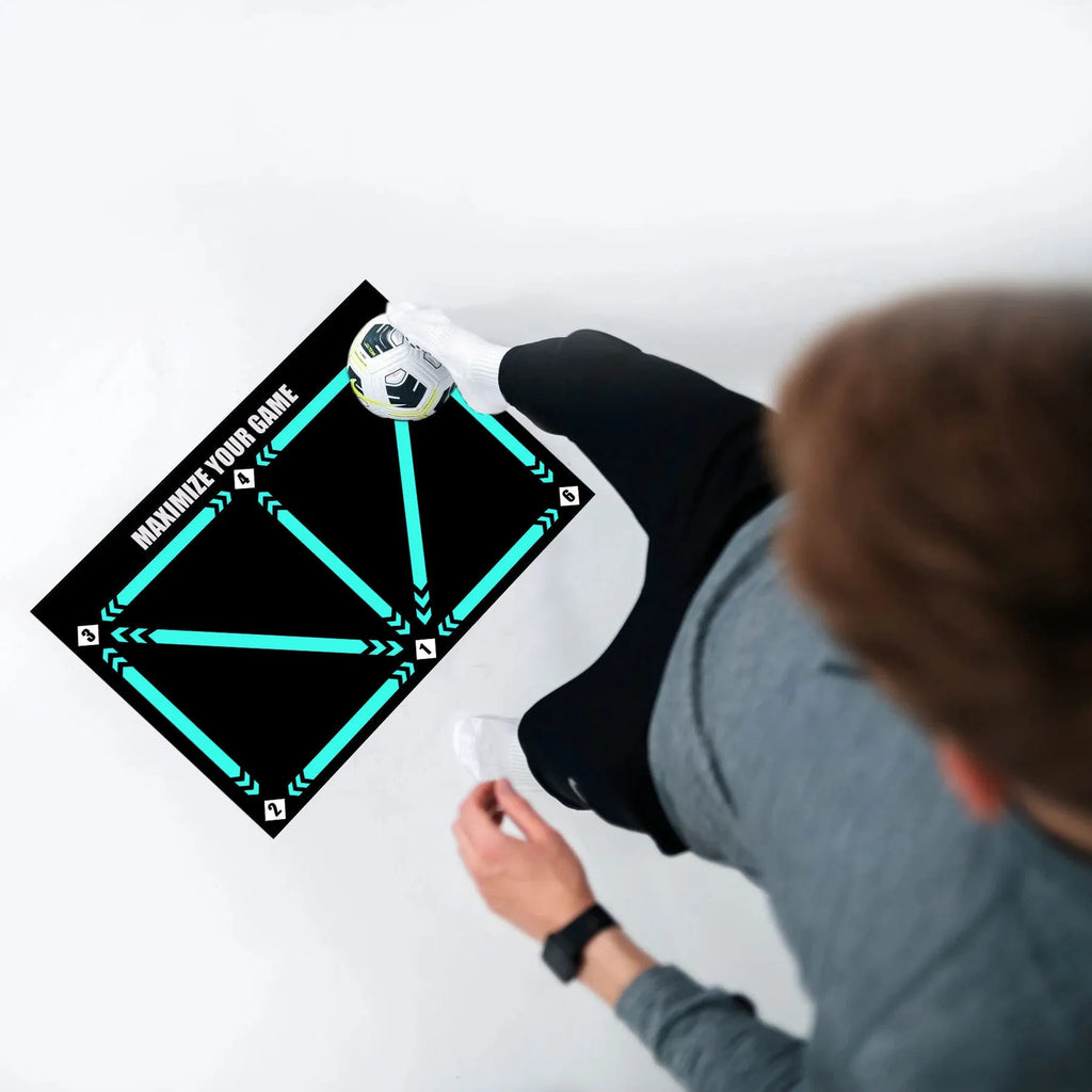Black non-slip football training mat measuring 60 by 90 centimetres