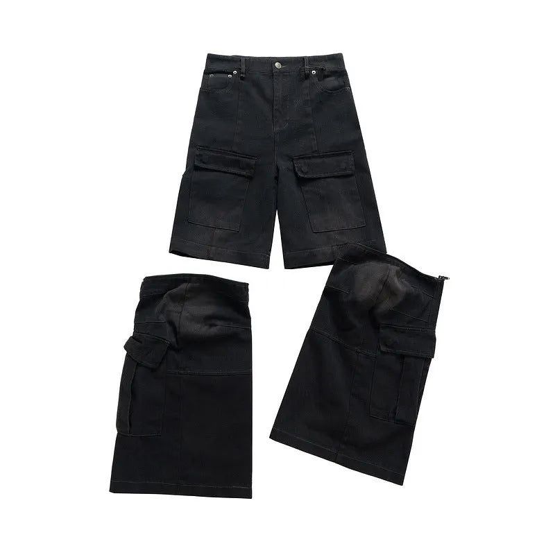 Black washed-out cotton overalls with detachable straps and multiple pockets on a hanger.