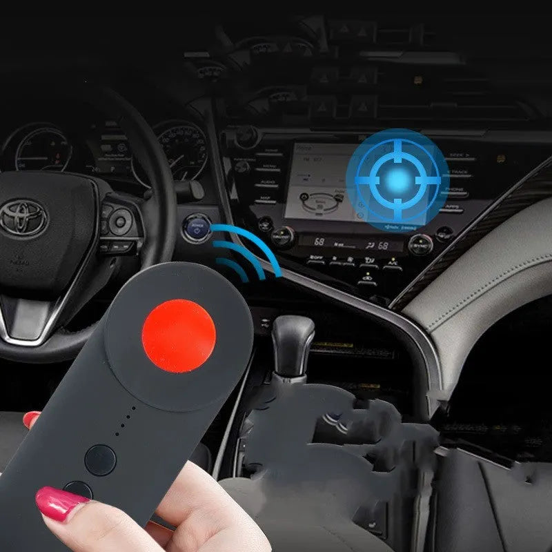 Black portable camera and GPS signal detector with USB charging port on a flat surface.