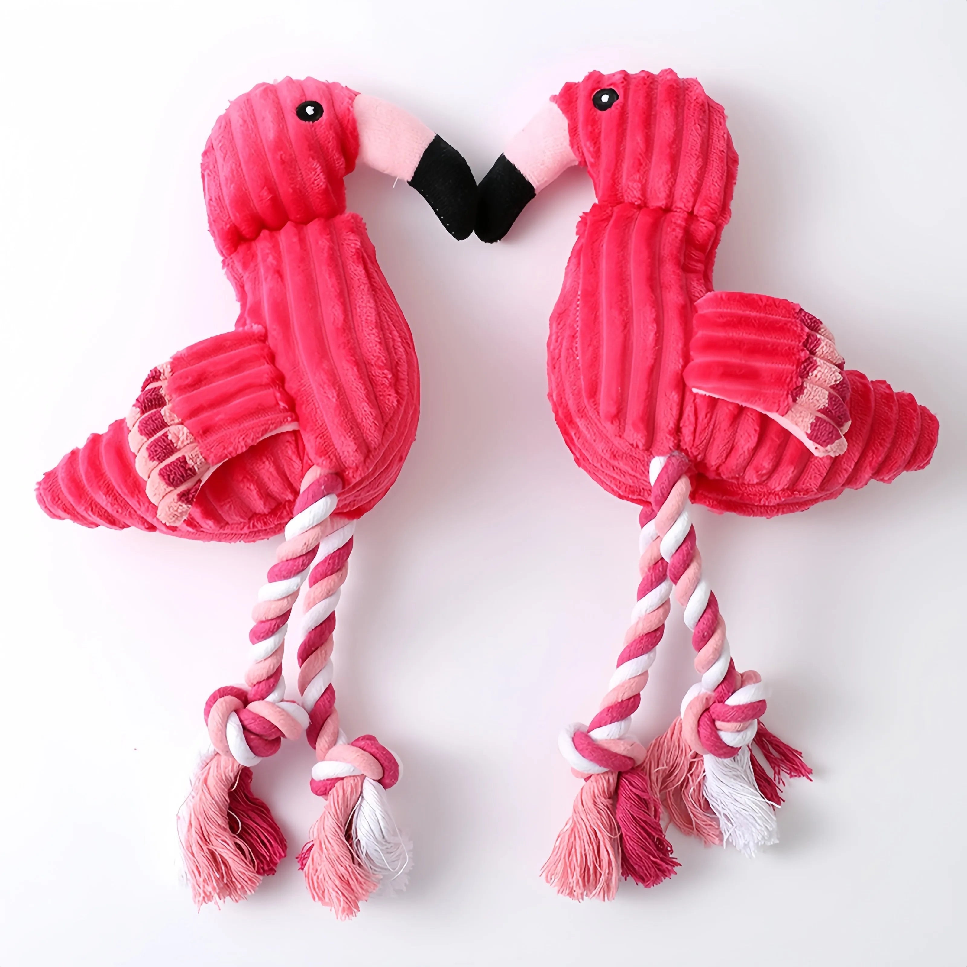 Pink animal-shaped corduroy squeaky dog toy with plush construction