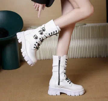 Women's black mid-calf knight boots with metal buckle detailing and side zipper