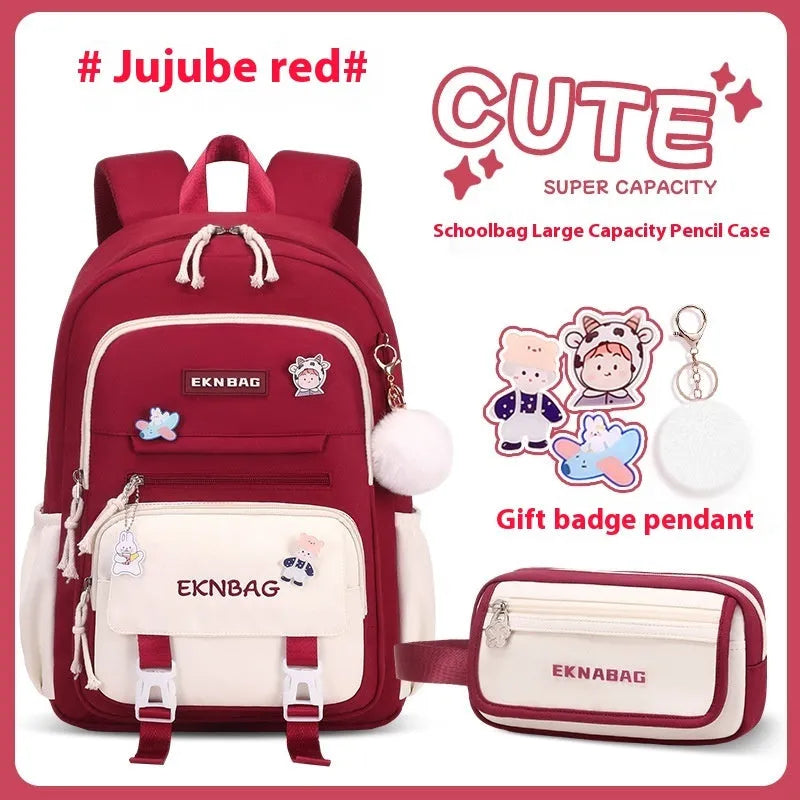 Girls' pink waterproof Oxford cloth school backpack with curved shoulder straps.