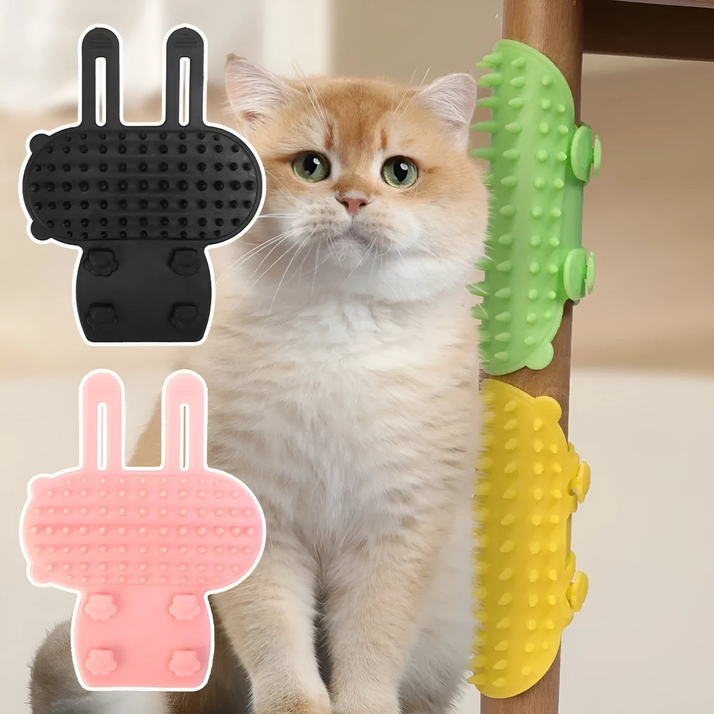 Black silicone cat grooming brush with comb teeth and an adjustable mounting strap.