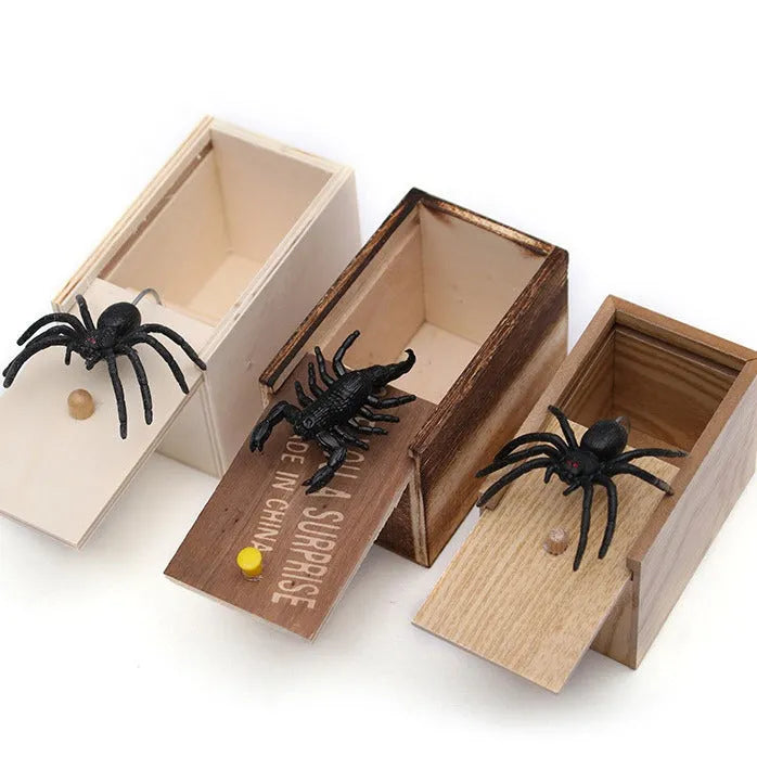 Camellia wood trick box with spider prank element on white background for scary spoof jokes