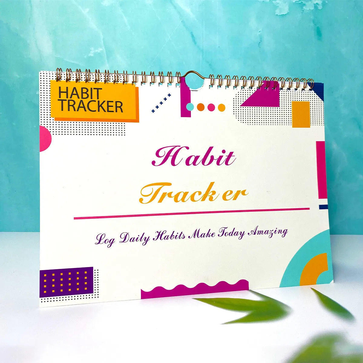 Habit tracking journal in four colour options showing 21cm × 28cm size