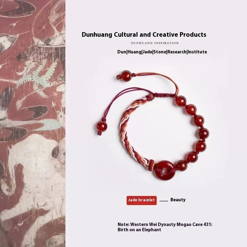 Red agate carrying strap bracelet with elk element on neutral background