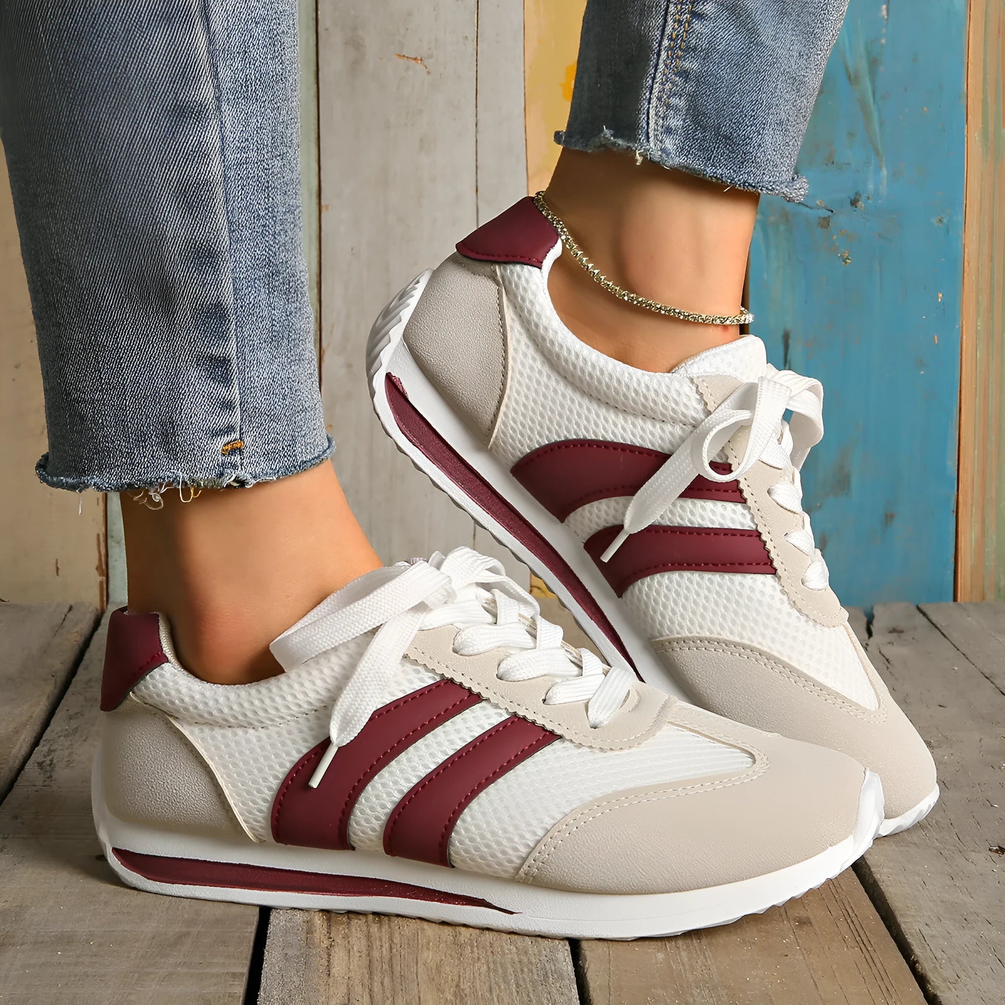 Women's wine red Cortez sneaker with cross-strap detail and breathable mesh upper