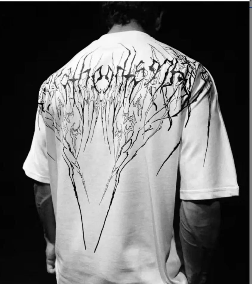 Loose fit dark coloured cotton T-shirt with short sleeves and gilding decorative detail.