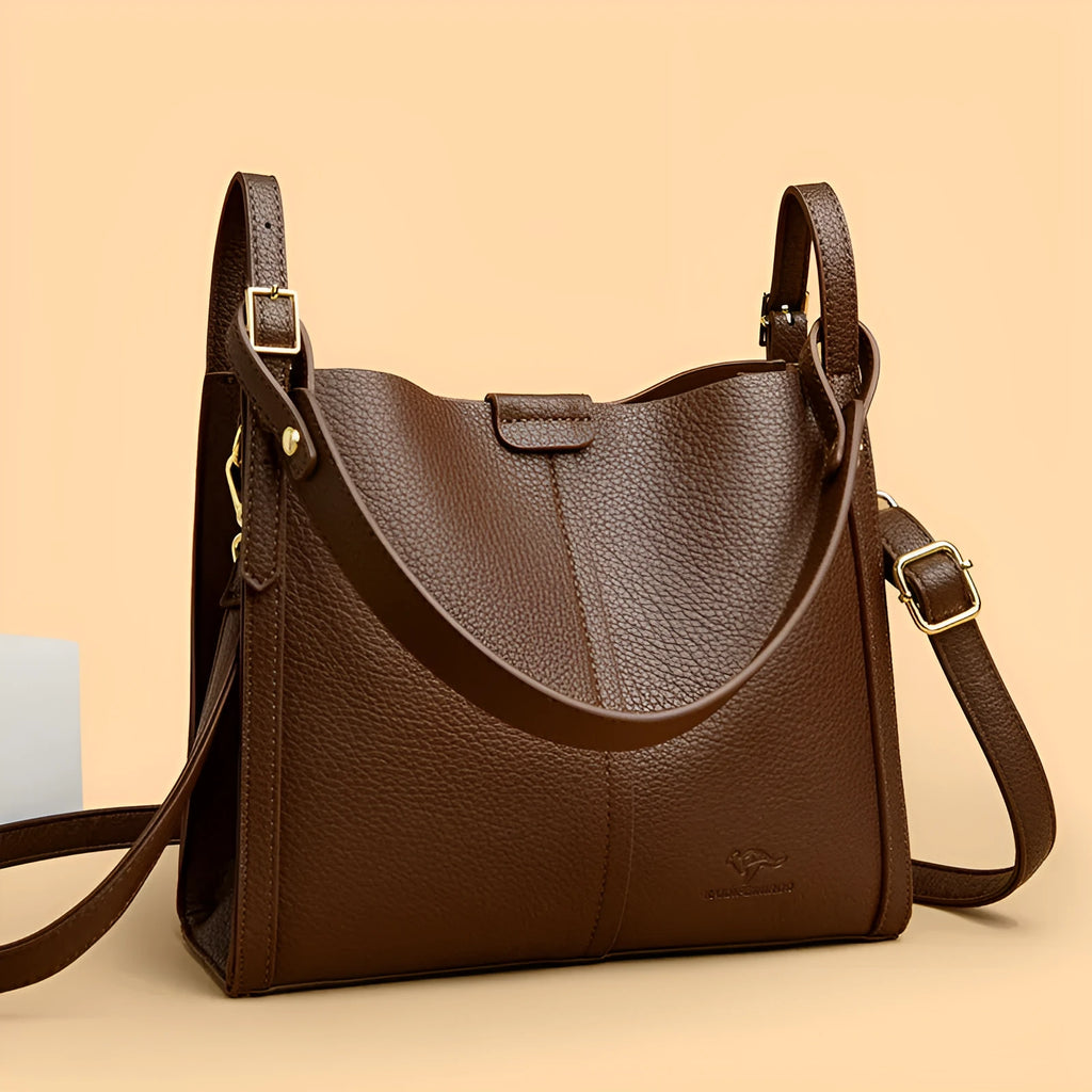 Brown retro ladies shoulder bag with zip compartments showing vertical square shape and single strap