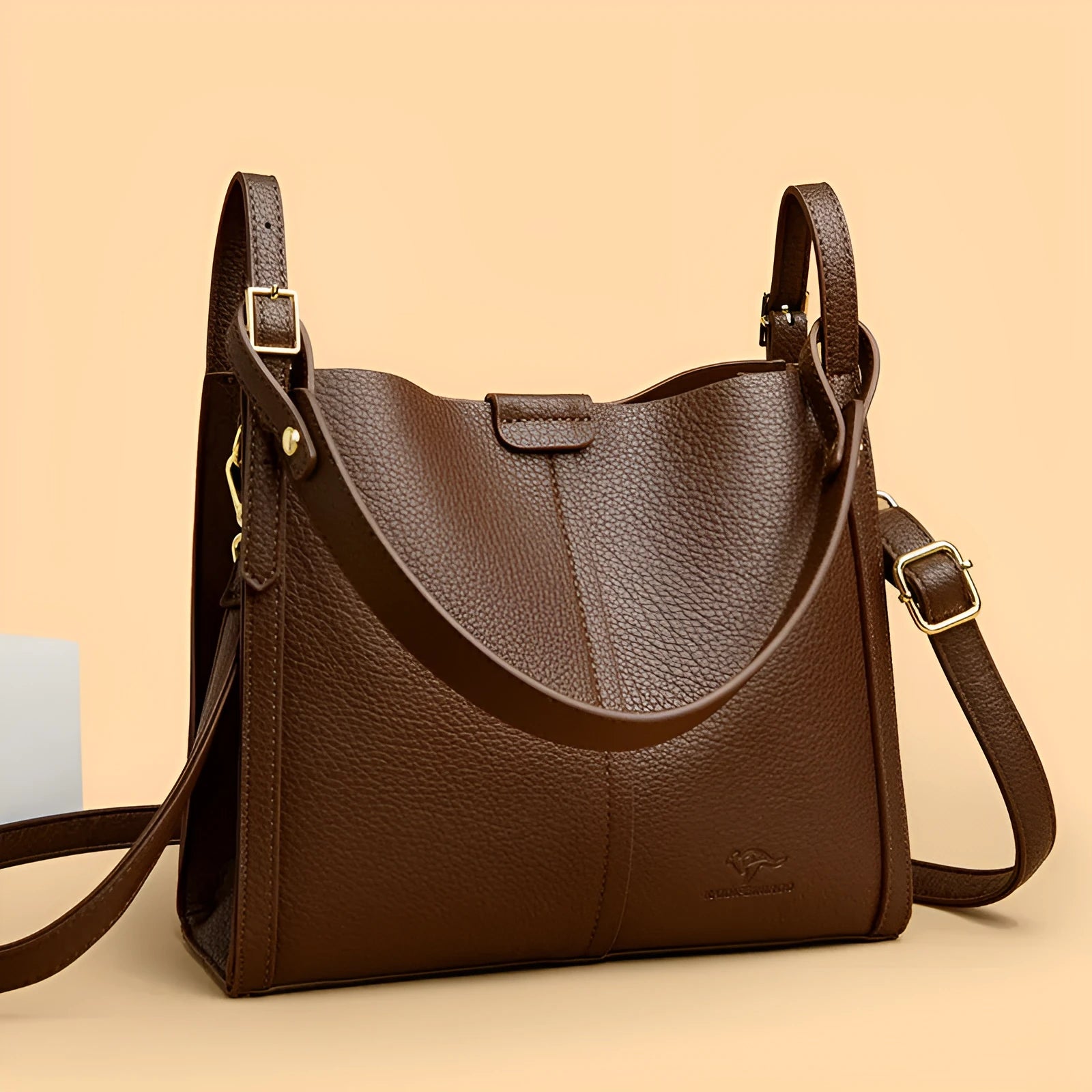 Brown retro ladies shoulder bag with zip compartments showing vertical square shape and single strap