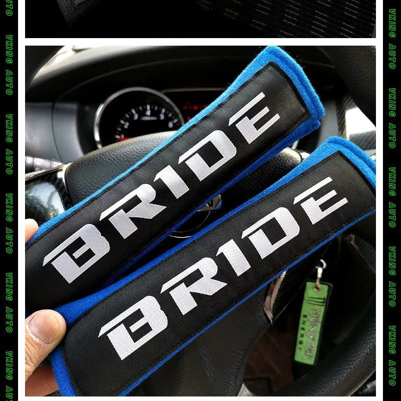 Car safety belt shoulder pad set in black showing cotton construction and embroidery detail