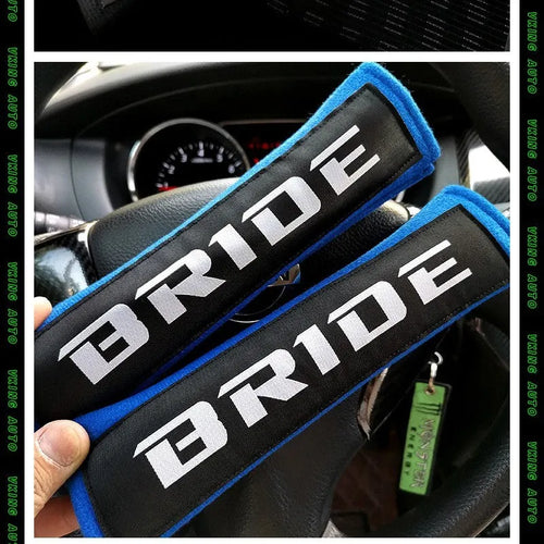 Car safety belt shoulder pad set in black showing cotton construction and embroidery detail