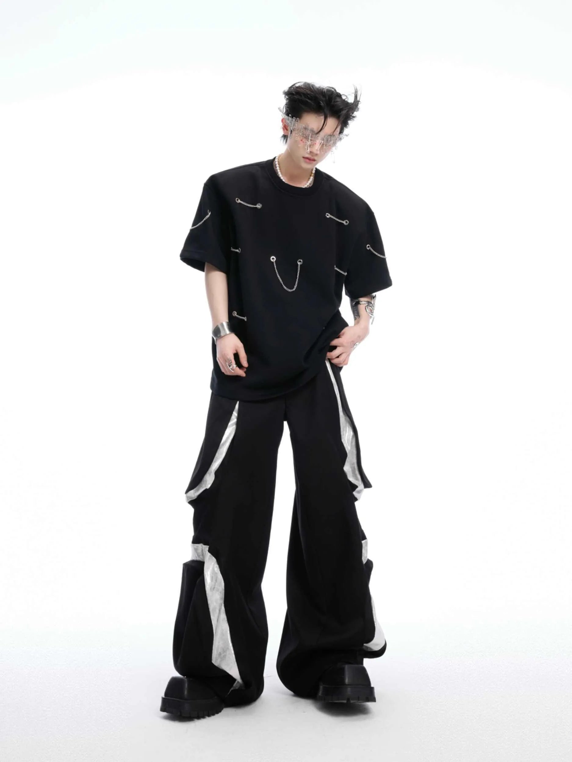 Black heavy cotton t-shirt with metal chain padded shoulder detail, round neck, short sleeves