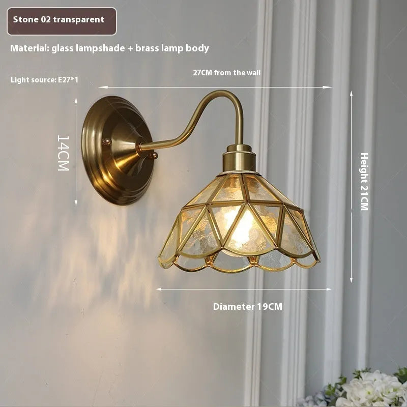 Retro brass wall lamp with stone-patterned transparent glass shade and copper body