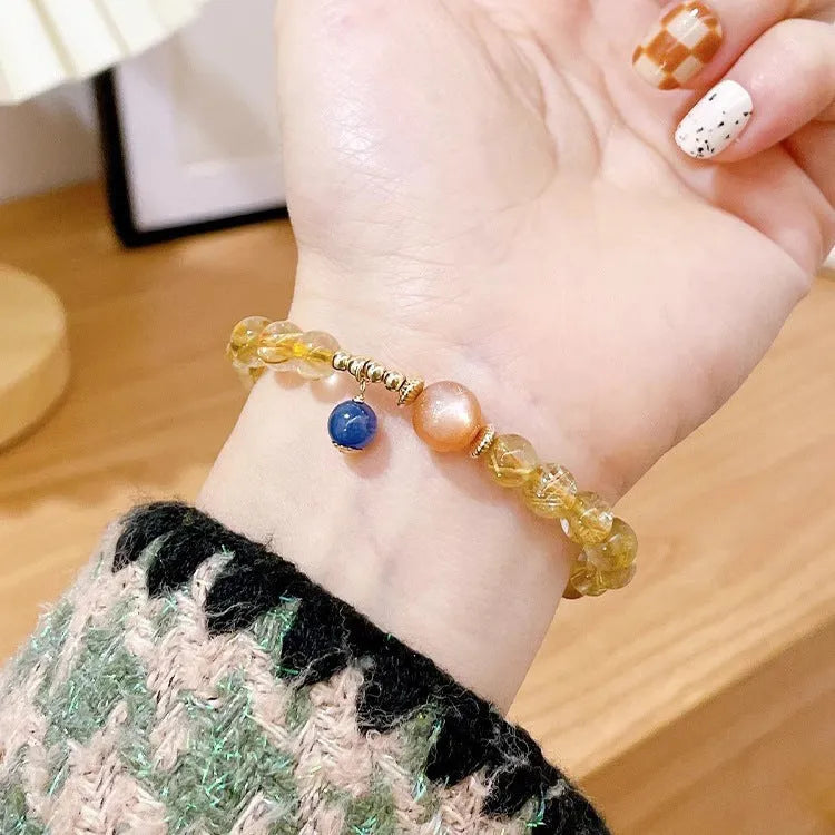 Women's gold rutilated quartz sunstone crystal bracelet with diamond beads