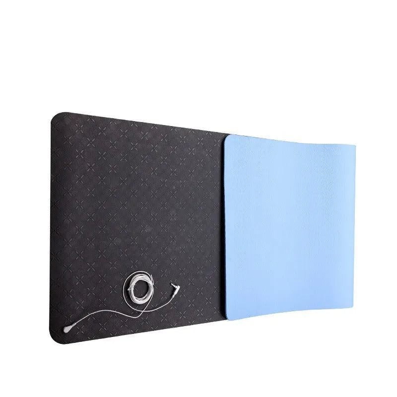 Blue conductive yoga mat with floral pattern, grounding wire, and non-slip surface.