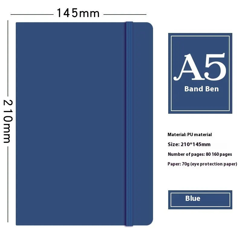 A5 faux leather notebook with pen insert and strap, open on a desk showing lined pages