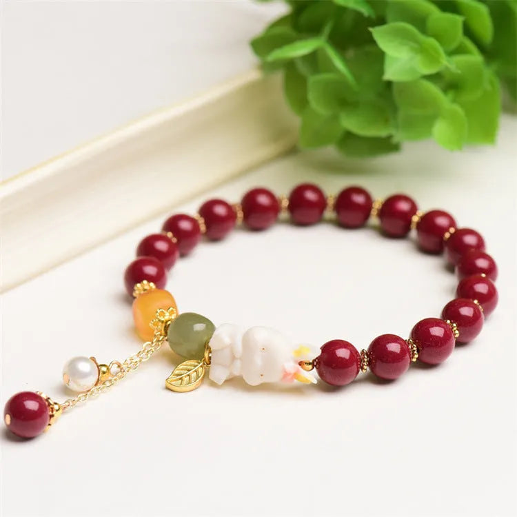 Tian Yu natural cinnabar bracelet with rabbit motif in purple gold sand colour