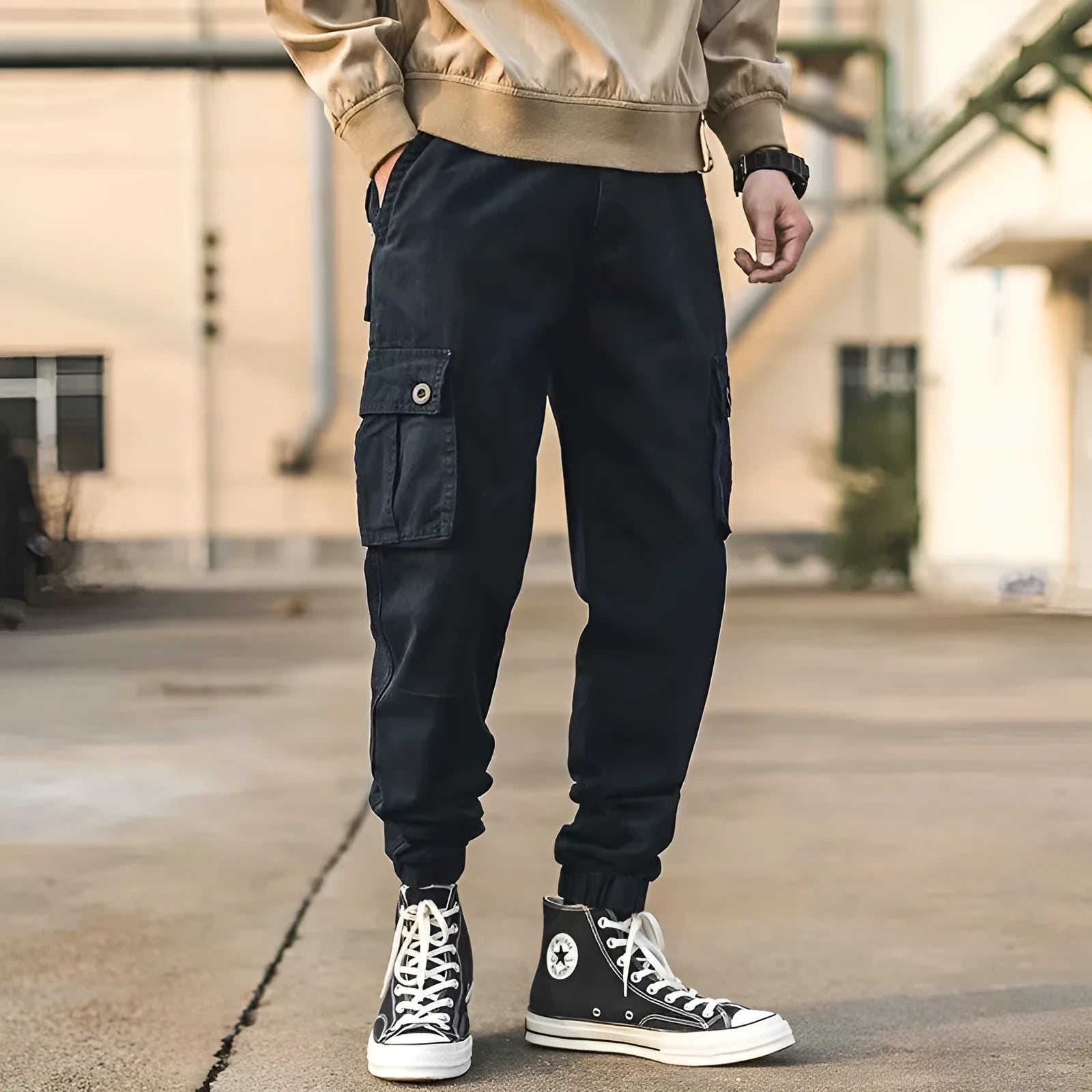 Men's black cotton overalls with loose cropped fit, ankle banded hem, and multiple pockets