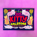 Cat themed wall calendar with monthly tear-off pages for 2024 or 2025.