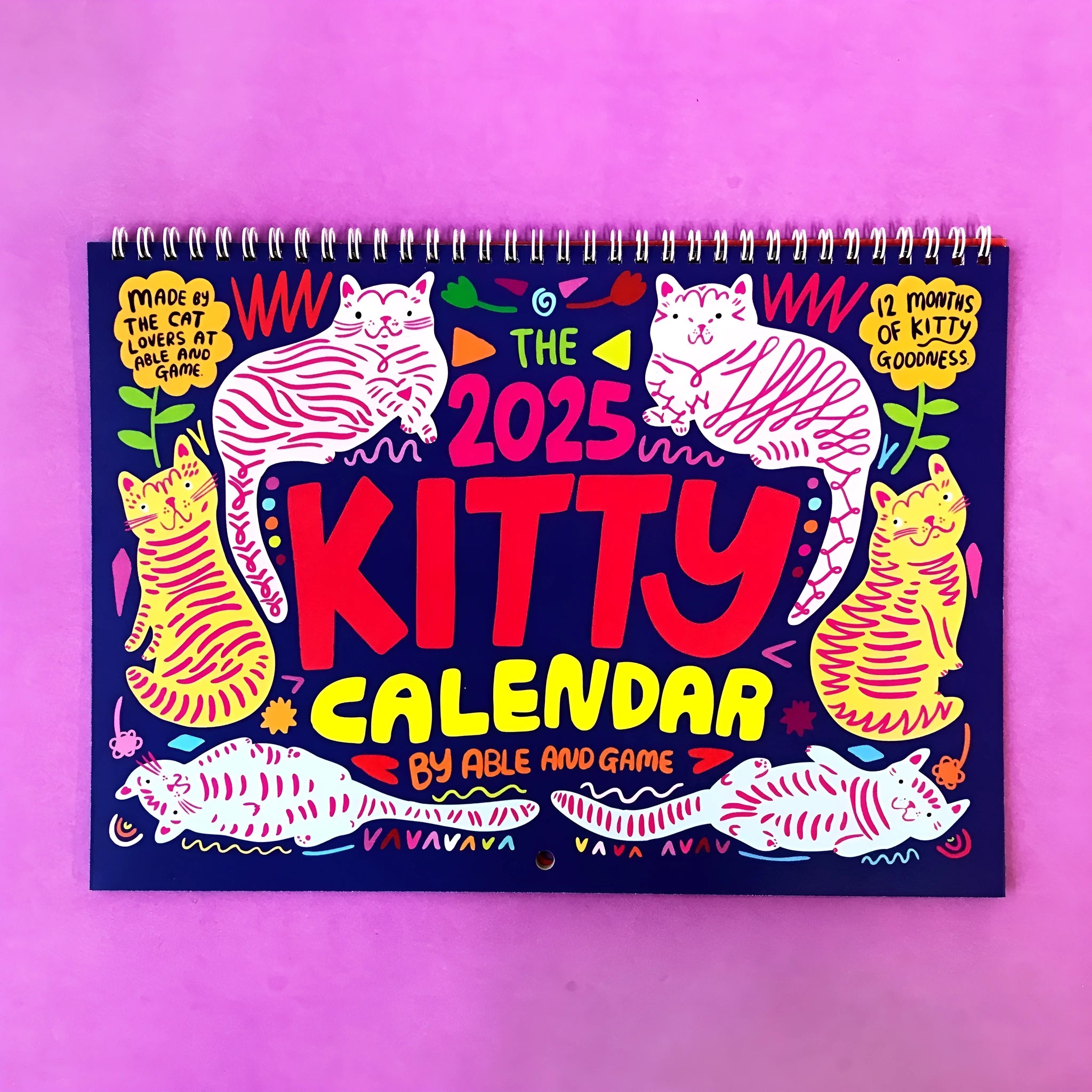 Cat themed wall calendar with monthly tear-off pages for 2024 or 2025.