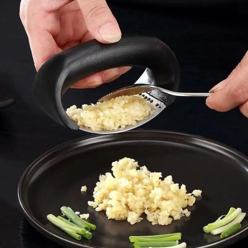 Stainless steel garlic masher press with ergonomic handle and non-slip grip