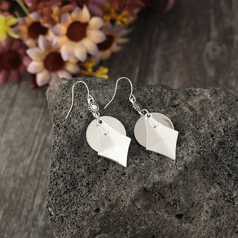 Silver geometric alloy earrings with layered retro design and round shape