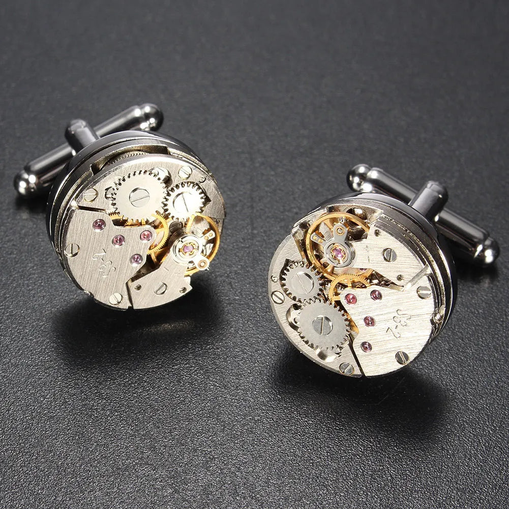 Silver geometric men's cufflinks with copper body and mechanical watch movement on dress shirt cuff