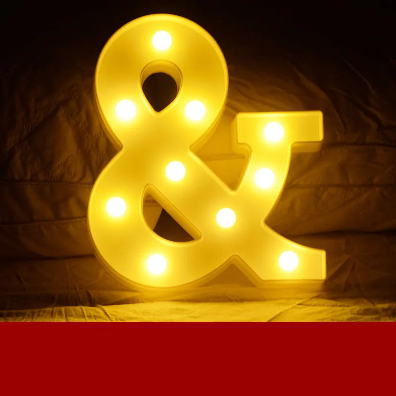 Plastic LED letter light decoration spelling a message, 22cm in height.