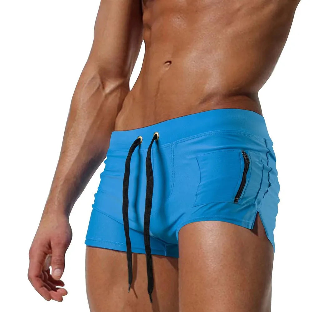 Men's black high-waist swimming trunks with a white lace-up closure on the front.