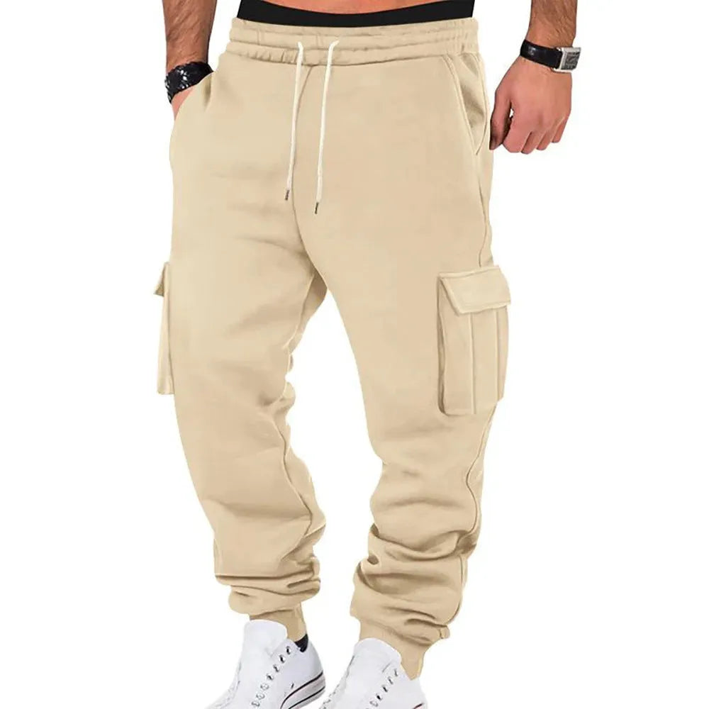 Men's solid colour casual multi-pocket drawstring sports pants in black, featuring polyester fabric and mid-waist design