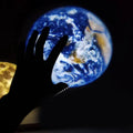 White ABS star projector with flexible hose, showing earth and moon projection chips and USB cable.