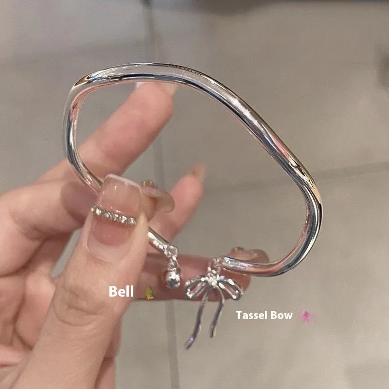 Silver adjustable girlfriends bracelet with bow-shaped bell opening clasp