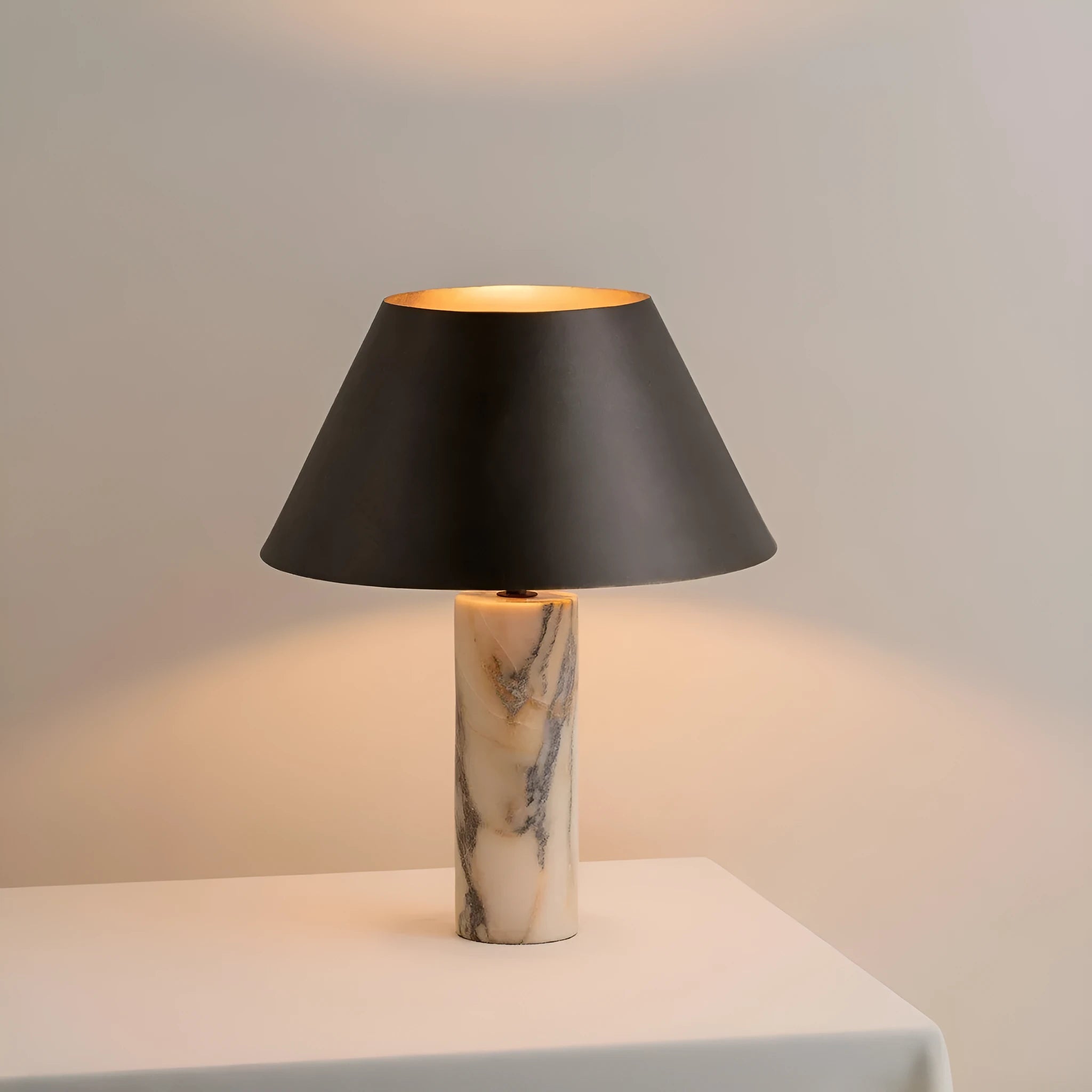 Black modern marble table lamp with LED light source on wooden surface