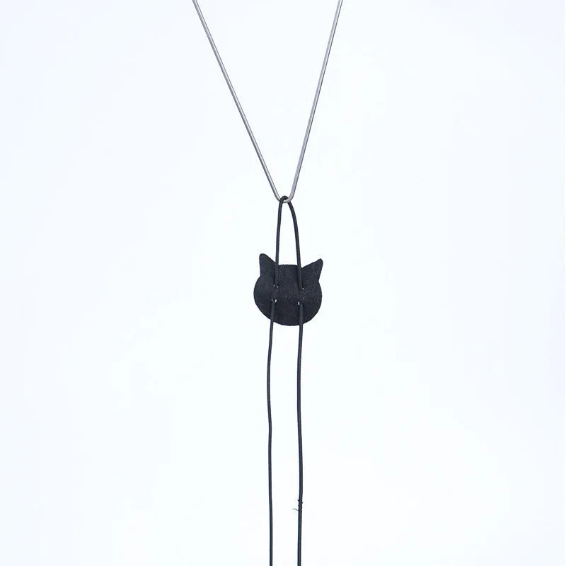 Cat toy with telescopic elastic rope hanging from door with plush mouse-shaped toy at bottom