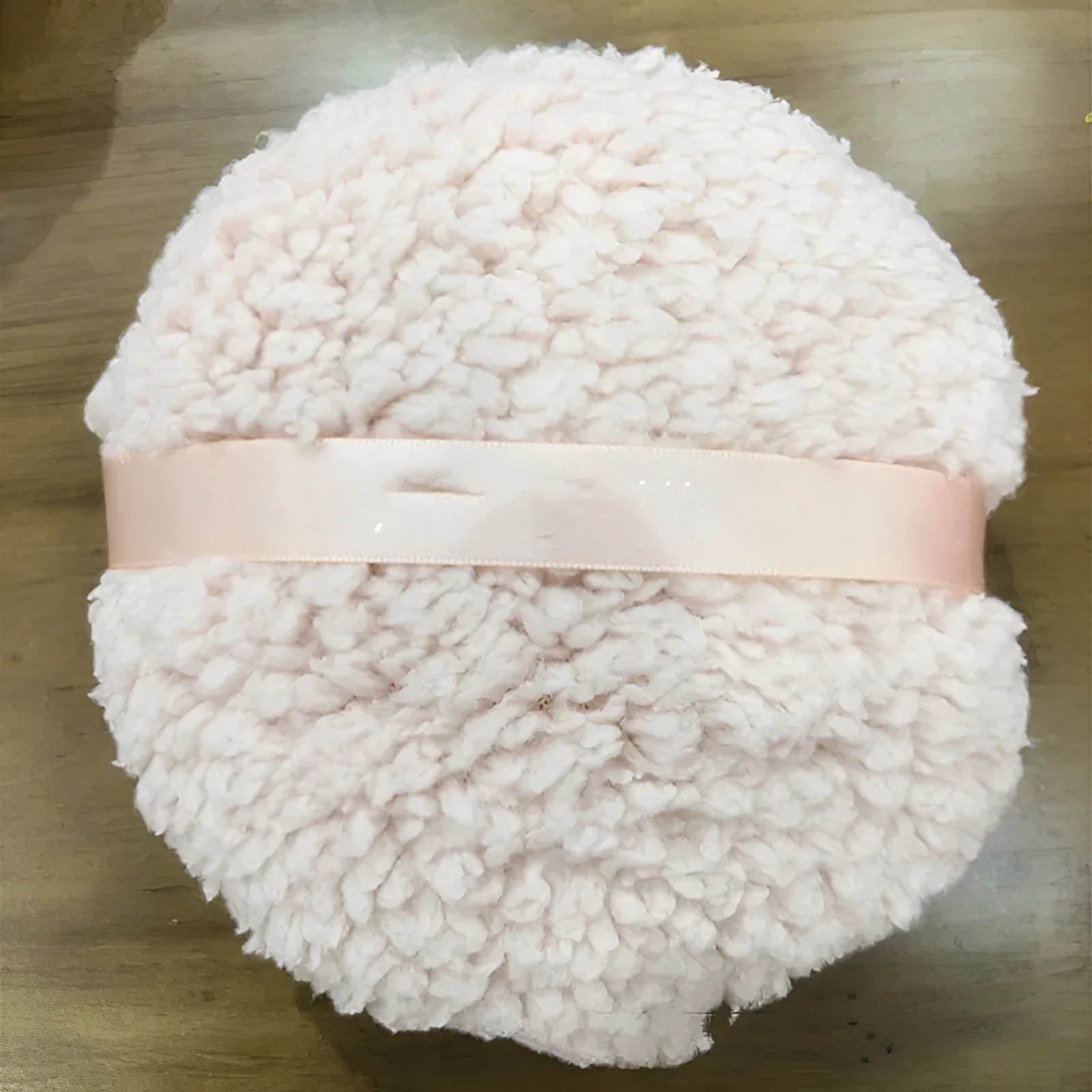 Oversized plush dry powder puff makeup applicator measuring 150x75mm in pink, white, and skin colour options