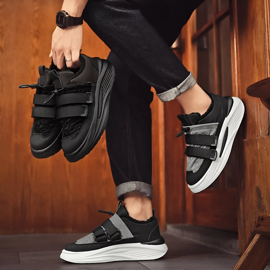 Men's black and gray platform sneakers with lace-up fastening and striped cotton upper on a white background